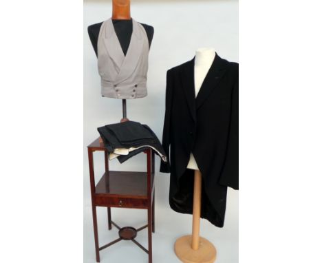 A vintage morning suit comprising jacket, grey half waistcoat and trousers. 44" chest and trousers (let out at back with inse