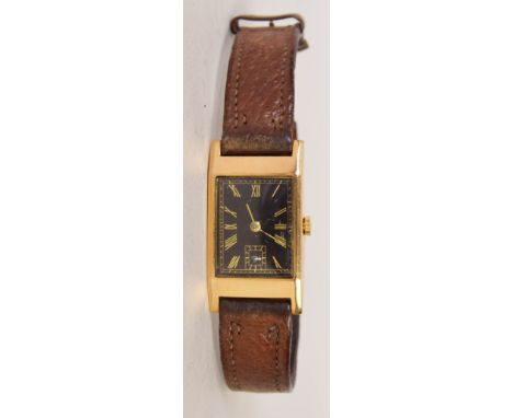 An Art Deco yellow metal gentleman's wrist watch with Swiss swan neck movement and leather strap