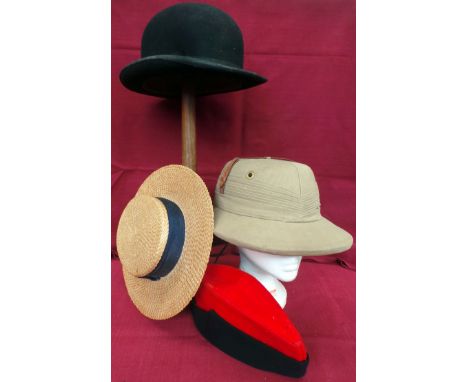 Four vintage hats. A vintage khaki pith helmet in lovely condition with leather adjustable sweatband and labelled 'Real Sola 