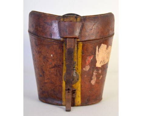 A leather top hat travel case with quilted red silk interior and vintage travel labels, 30cmW, 40cmH