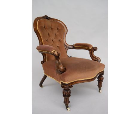 A mid-Victorian walnut gentleman's chair with button upholstered back, 94cmH
