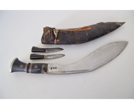 A kukri/khukuri dagger, probably Nepalese from the DKW factory, debossed with DKW near the hilt, complete with smaller karda 