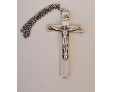 A large silver crucifix on a chain, engraved on the reverse with 'In Te Domine Speravi' and 'E.W.F Eric 1915' and with an ima