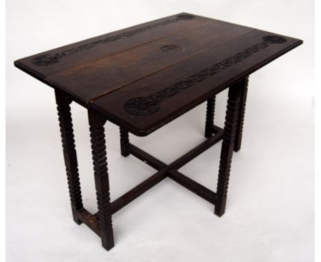 A late Victorian drop leaf table with celtic strapwork carved decoration, 110 x 78 x 76cmH