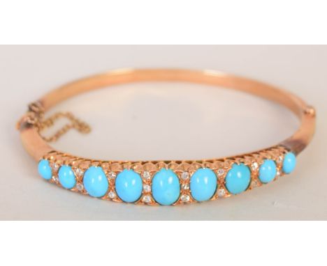 A 15ct gold ladies bangle set with nine cabochon turquoises interspersed with diamond chips