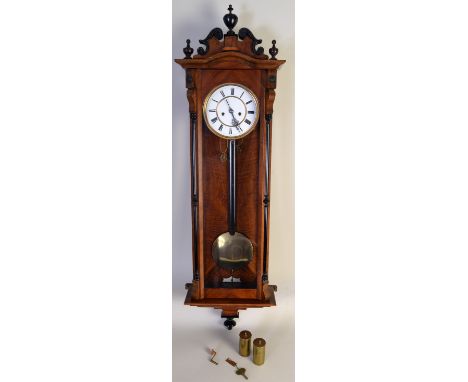 A late 19th century Vienna regulator wall clock, with a single pendulum and a white enamel dial with Roman numerals, 18cmD, i