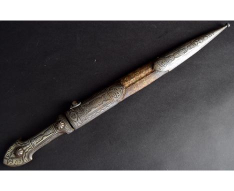 A Middle Eastern white metal dagger ornately engraved on the hilt and blade together with scabbard with textile bound middle 