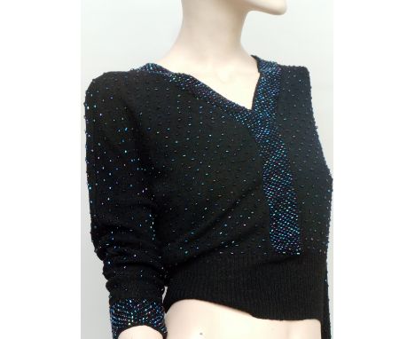 A beautiful 1940s/50s black beaded sweater, neckline and cuffs have denser beading, the garment is in good vintage condition,