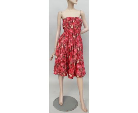 Two 1950s dresses. A Frank Usher patterned full skirt strapless sun dress. Garment has boned and ruched bodice and features a