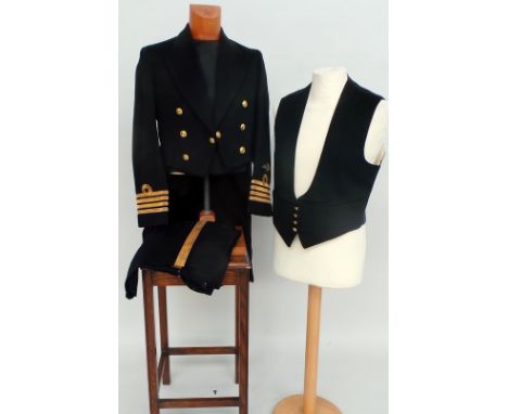 A vintage 'Gieves' tailored Captain's Fleet Air Arm mess suit. Tail coat and trousers with gold braiding together with waistc