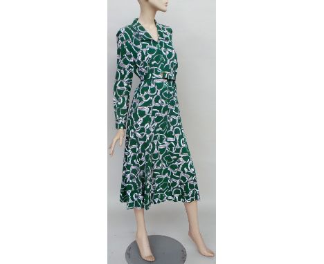 A selection of 1960s and 70s dresses, seven in total. A green and white cotton jersey 'Hennie Gras' belted shirt dress, a flo