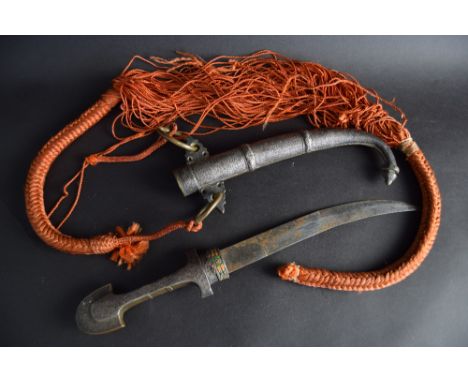 A Moroccan koummiya dagger with scabbard in white metal and brass with filigree design and orange and green enamel design aro