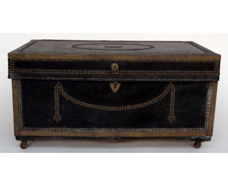 A late 17th century travel trunk bearing brass label 'Captain Pyne' to top, covered in leather with studwork, metal banding a