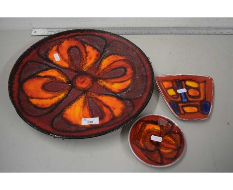 Poole Pottery charger together with two similar small dishes (3)