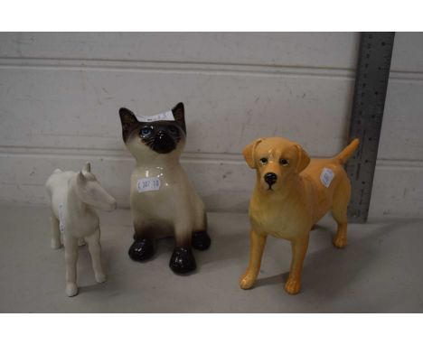 A Beswick model labrador together with a Winstanley Pottery cat and a further model horse (3)