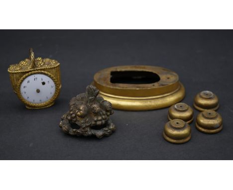A French gilt metal grape basket clock and other clock mount pieces. The clock has white enamel dial with black numerals, mov