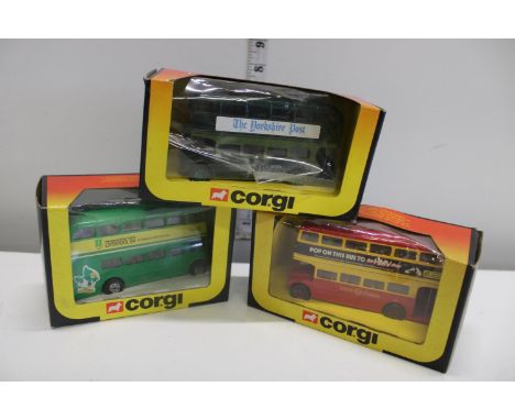 Three boxed Corgi die-cast bus models 