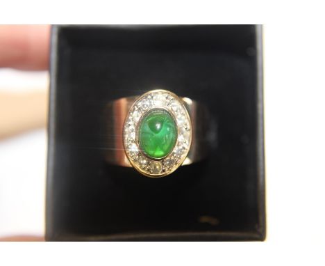 A 18ct gold ring with green central stone. 8.73 grams (for scrap or repair) 