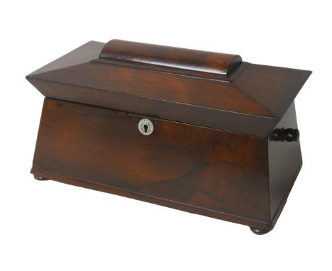 A 19th century mahogany sarcophagus form tea caddy, with glass mixing bowl and two internal lidded compartments, raised upon 