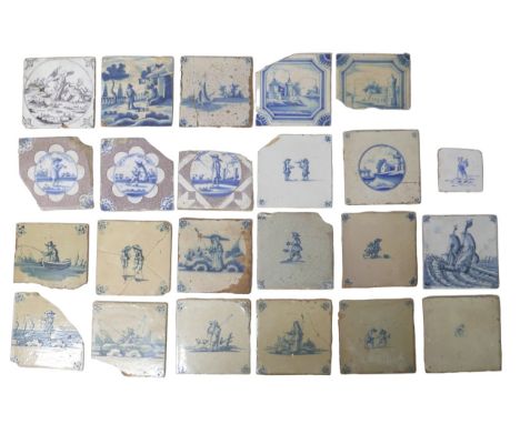 A collection of twenty-three 19th Century onwards delftware tiles, including examples depicting ships, fishing, and men on st