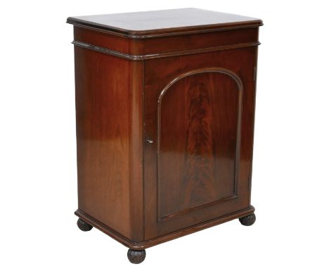 A Victorian mahogany cupboard, single door opening to reveal a single shelf and bottle / decanter storage below, raised on ba