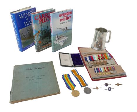 A WWII DSC medal group and log book belonging to Donald Judd, comprising a Distinguished SC hallmarked and dated 1945 verso w