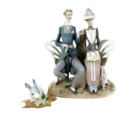 A Lladro figural group, modelled as ' Lovers On A Bench In The Park', model 1274, with impressed factory marks, a/f some dama