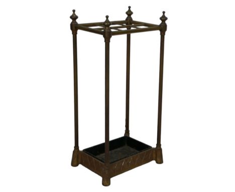 An Edwardian brass six division stick stand, with removable black painted drip tray, 30.5 by 22 by 62.5 cm high. 