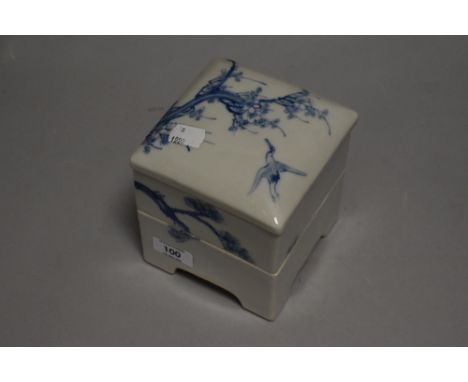 A Chinese porcelain stackable container decorated with cherry blossom tree bearing impressed seal mark