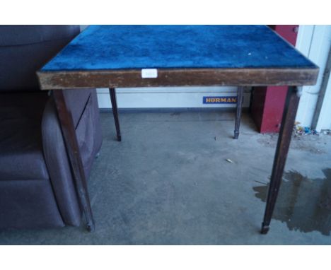 A folding card table