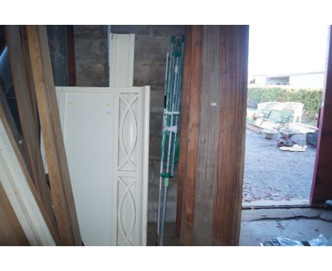 A long handled pruner and a rotary linen line