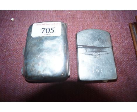 A cigarette lighter inscribed with initials dated 1918 and a silver cigarette case