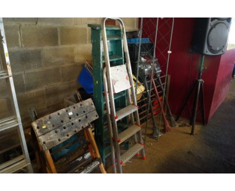A wooden step ladder together with an aluminium step ladder