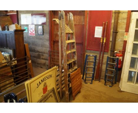 A wooden step ladder and small folding table