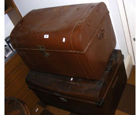 A wooden bound two handled metal travelling trunk and a metal ditto