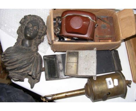 An old clockwork spit roast, together with periscopes, camera, etc.