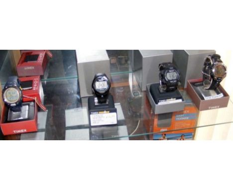 Four gents digital Timex wrist watches (new in original boxes)
