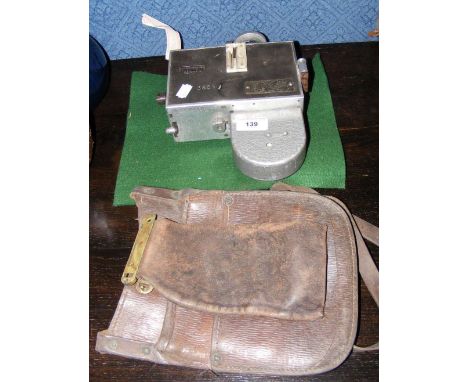 A vintage Bus Conductor's ticket machine, together with related leather bag