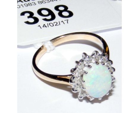 A 9ct yellow and white gold opal and diamond cluster ring - gross weight 2.5g