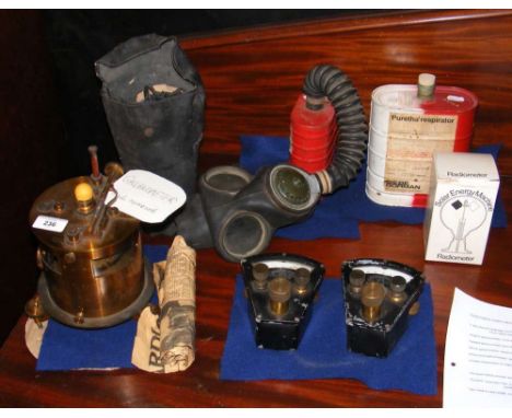 A galvanometer, together with vintage gas masks, etc.