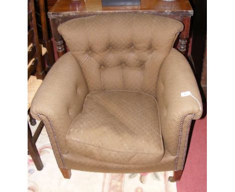 Antique easy chair with button back rest in light brown material