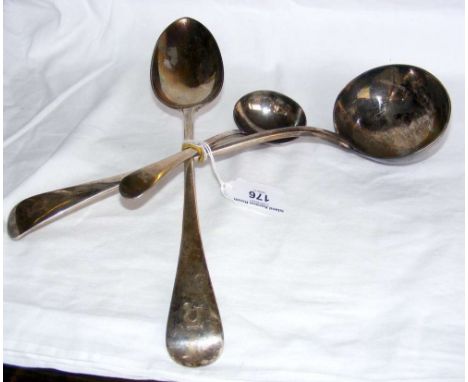 A silver ladle, together with basting spoon and sauce ladle