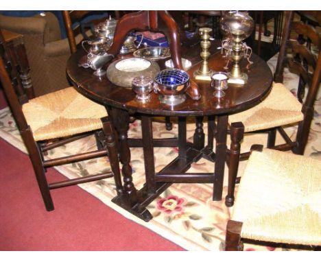 Small country oak gate-leg, together with four ladder back chairs