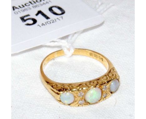 An 18ct gold opal and diamond seven stone ring