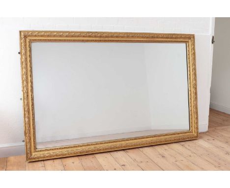 A Louis XVI-style giltwood mirror, c.1900, of rectangular shape, with a ribbon and stick decorated frame,192cm wide123cm high