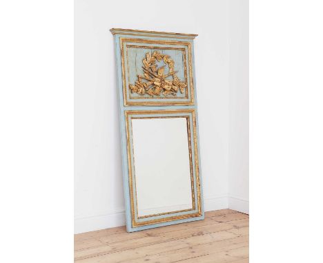A painted and giltwood trumeau wall mirror,20th century, French, the top section with applied, carved, musical trophies and f