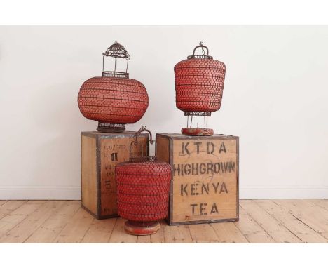 A Chinese wirework and red paper globe lantern,50cm wide70cm high, anda pair of similar lanterns,35cm wide65cm high (3)Proven