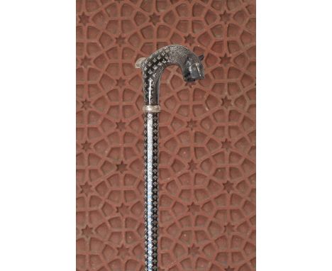 A niello-work sword stick, early 20th century, the handle with a tiger's mask terminal, the sectional shaft enclosing a short