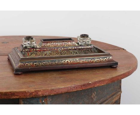 A boulle work desk stand,19th century, fitted with two inkwells over a pen tray,35cm wide24cm deep7cm highProvenance: The Gor