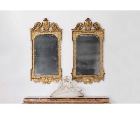 A pair of George II gilt gesso pier mirrors, c.1735-1740, attributed to Benjamin Goodison (c.1700-1767), each architectural f